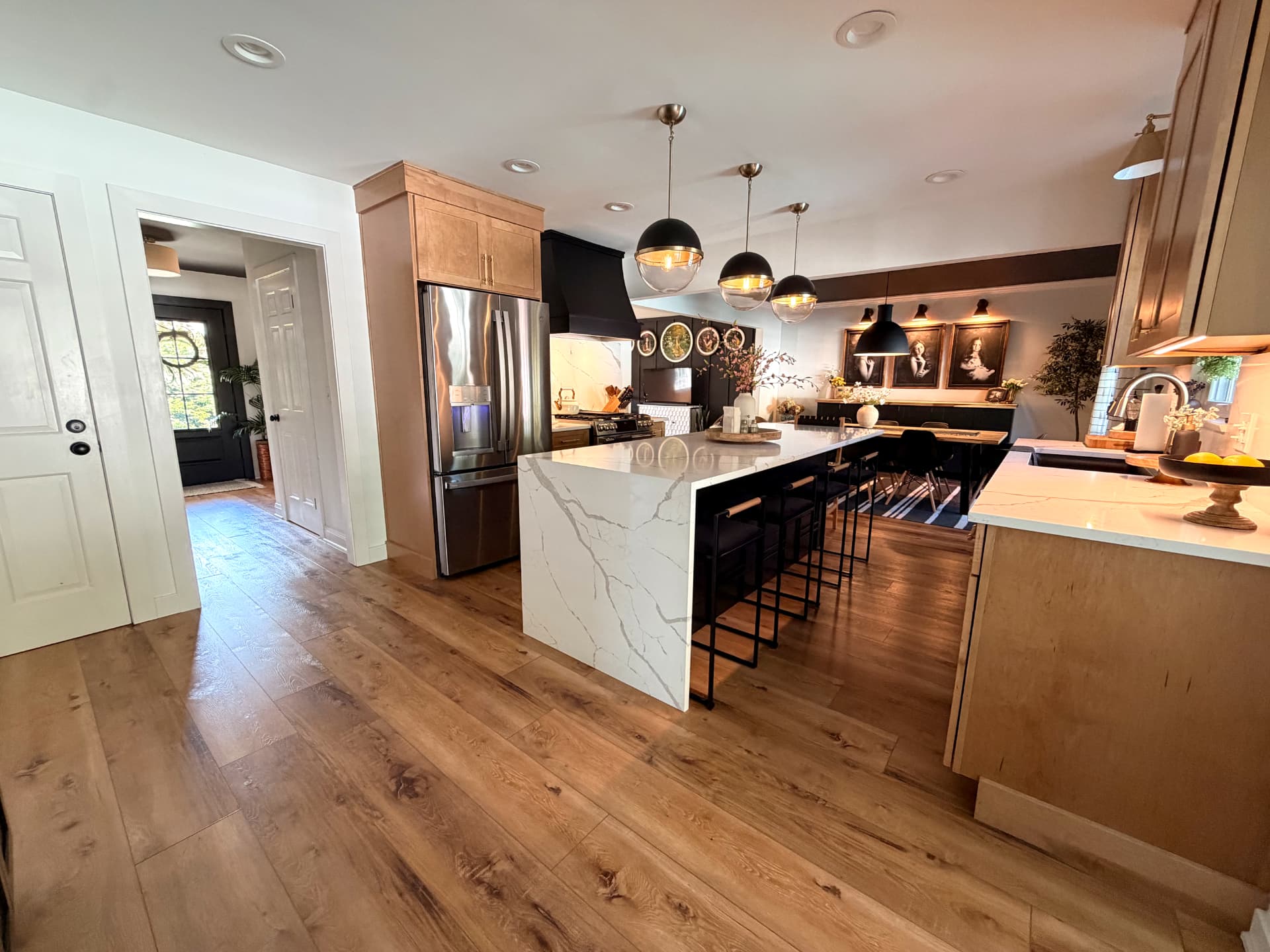 Kitchen island framed by warm North Shore Oak flooring