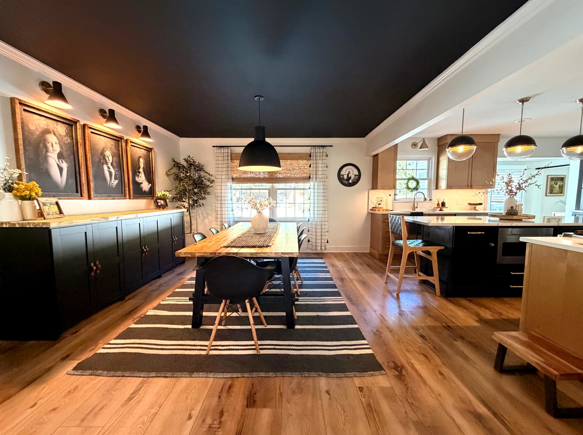 Dining and living spaces with continuous oak flooring