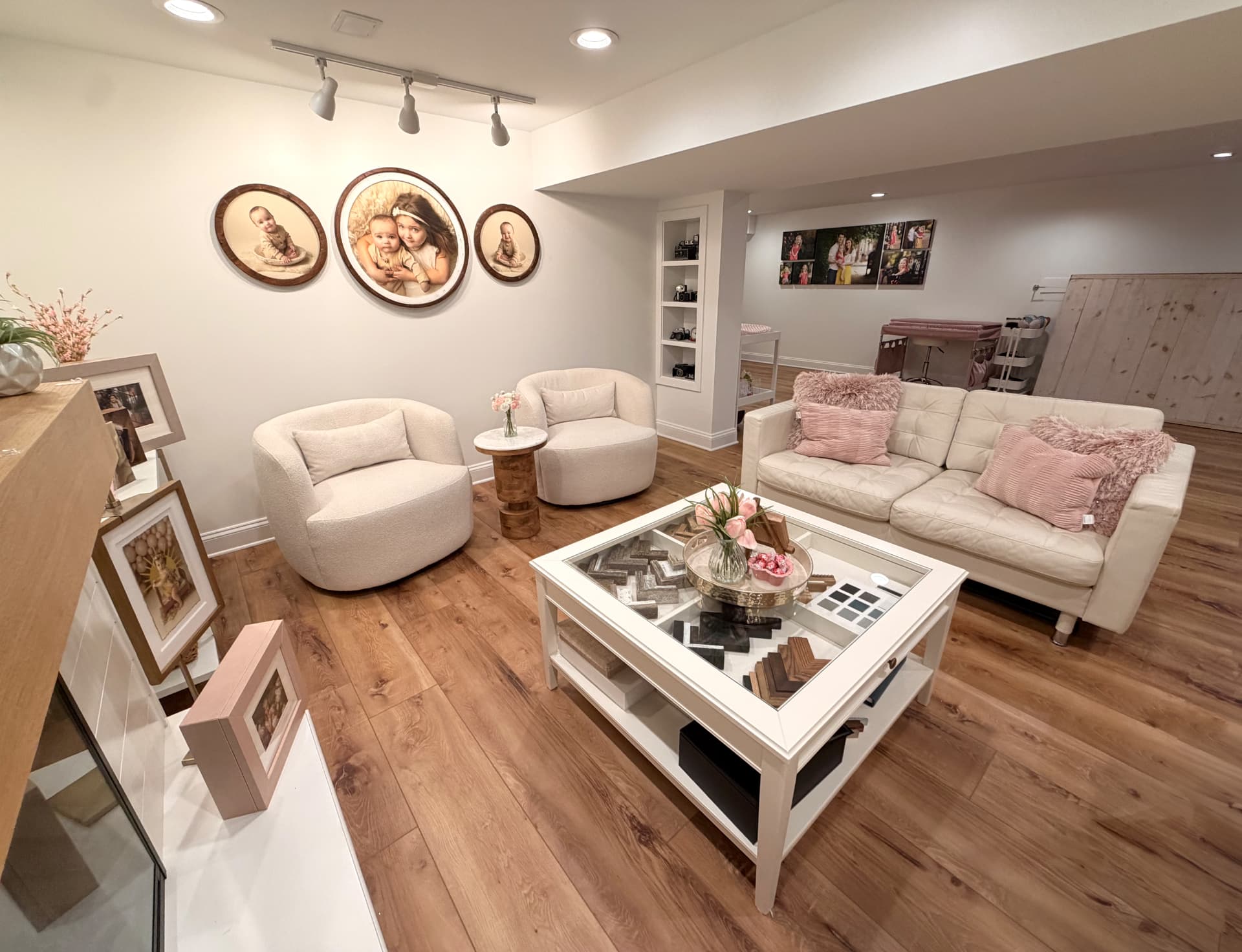 Wide living room with warm oak flooring and natural wood accents